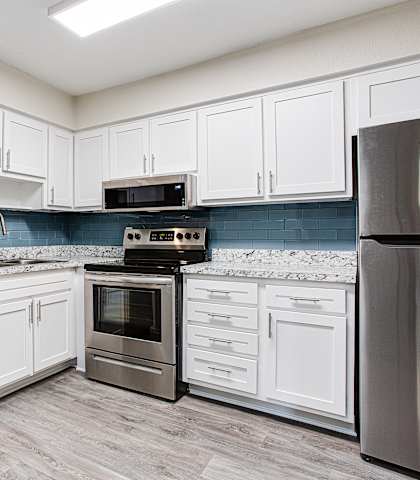 Kitchen with appliances and cabinets