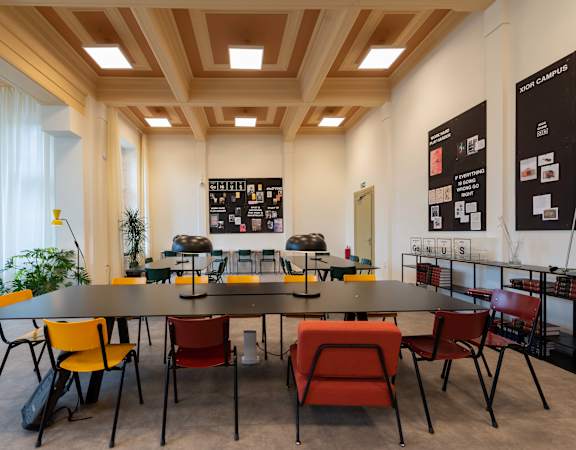 a large meeting room with a large table and chairs