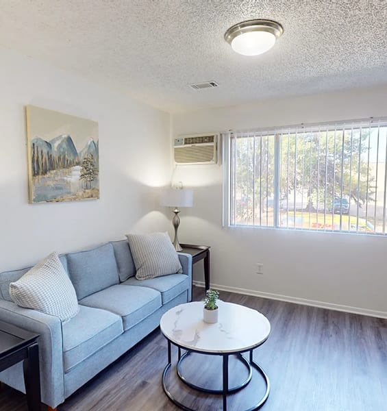 a living room with a couch and a table