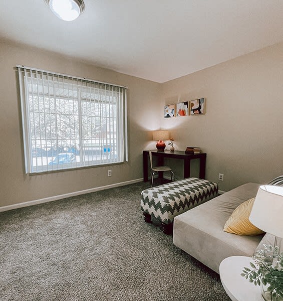 a living room with a couch and a window