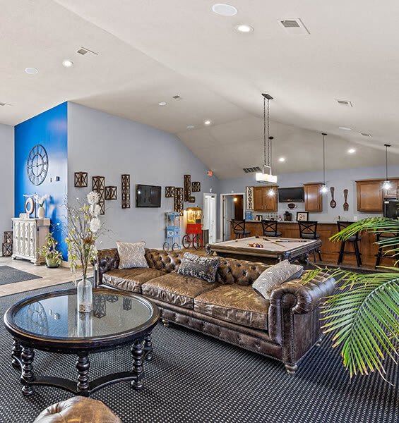 a large living room with a pool table