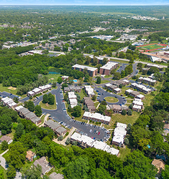 an aerial view of a city with buildings and trees