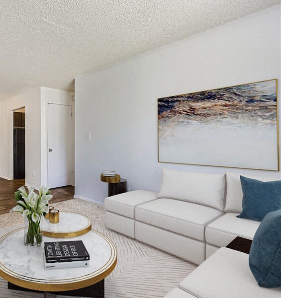 a living room with a white couch and a coffee table