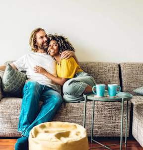 a man and a woman sitting on a couch