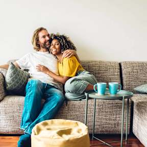 a man and a woman sitting on a couch
