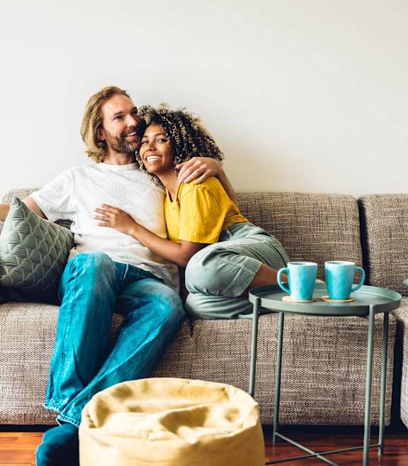 a man and a woman sitting on a couch