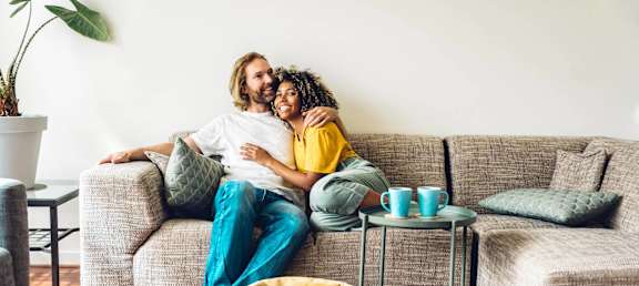 a man and a woman sitting on a couch