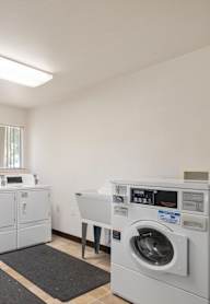 A laundry room with a washer and dryer.