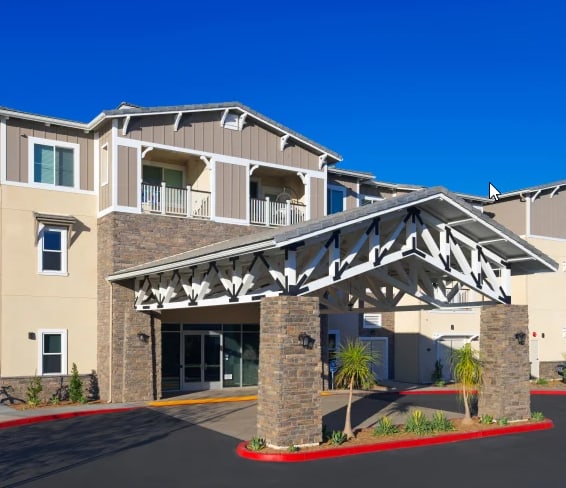 a building with awnings and a blue sky in the background
