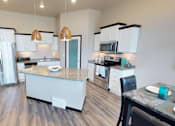 Thumbnail 2 of 21 - kitchen with island, pantry, copper light fixtures