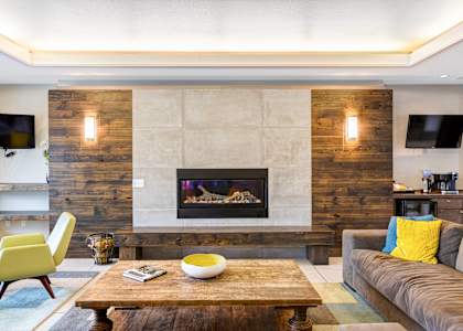 a living room with a fireplace and a coffee table