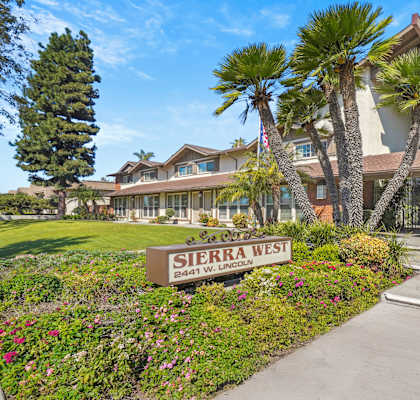 A sign that says Sierra West in front of a building.