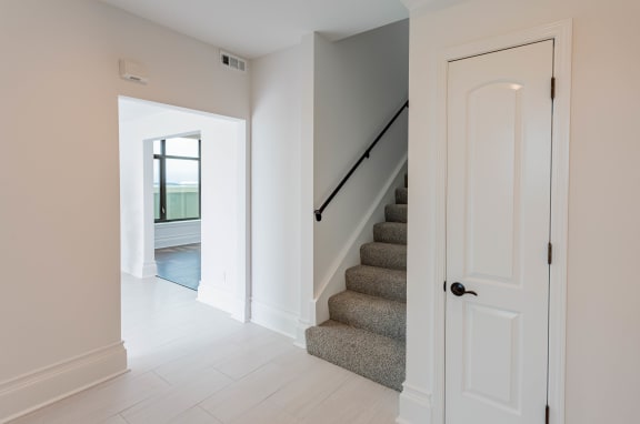 a view of a staircase in a home with white walls and a white door at Vendome Place, San Jose, 95110