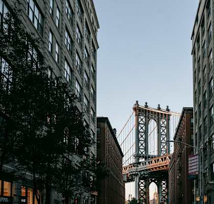 A bridge is seen between two buildings.