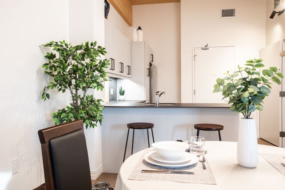 a kitchen or kitchenette and table settings