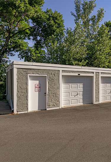A row of garage doors are closed. at Lou Park, Minnesota, 55426