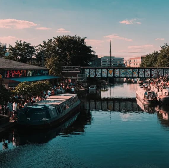 a bridge over a body of water with boats