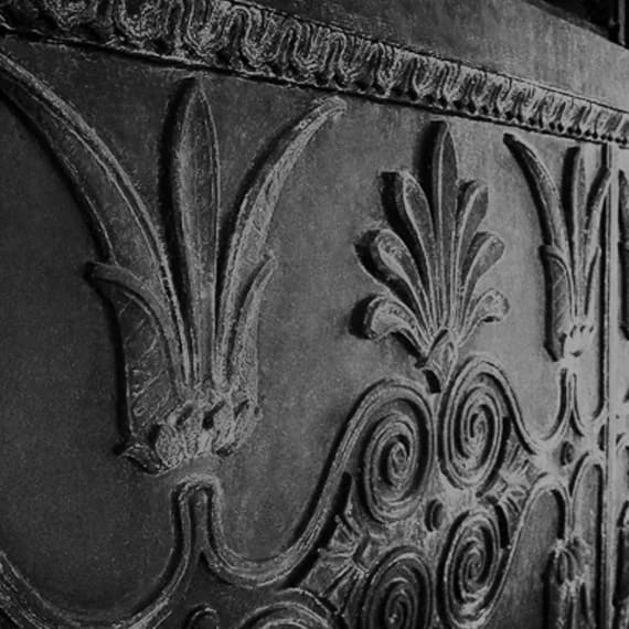 a close up of a carving on the back of a chair