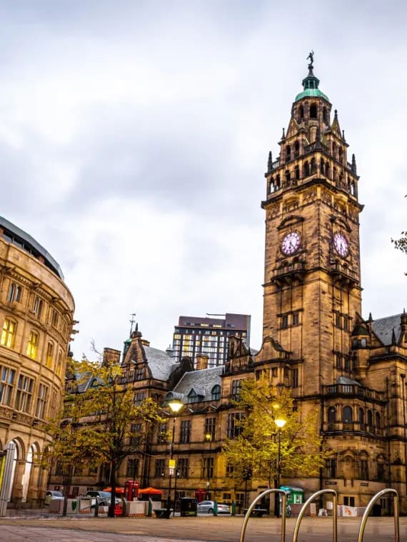 an old building with a clock tower in the city