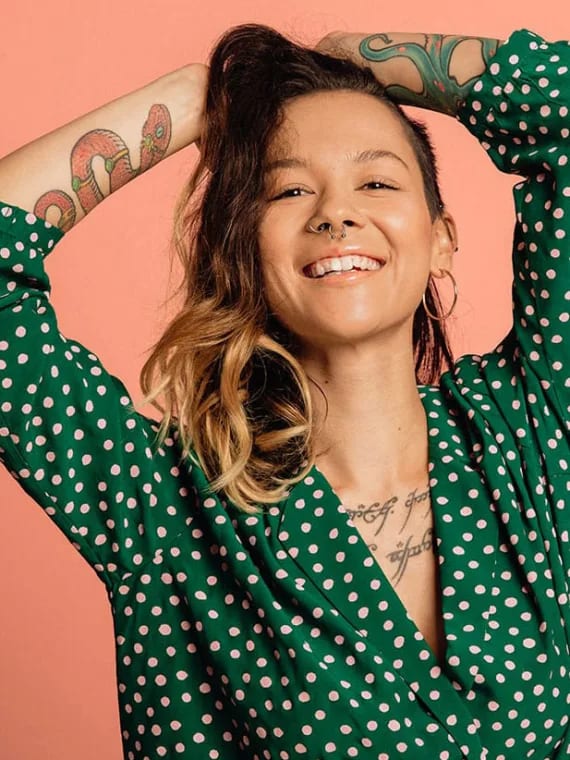 a woman in a green dress with green polka dots