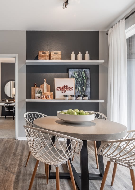 Dining room with balcony view at Pallas Town Homes and Apartments in Beaverton, OR