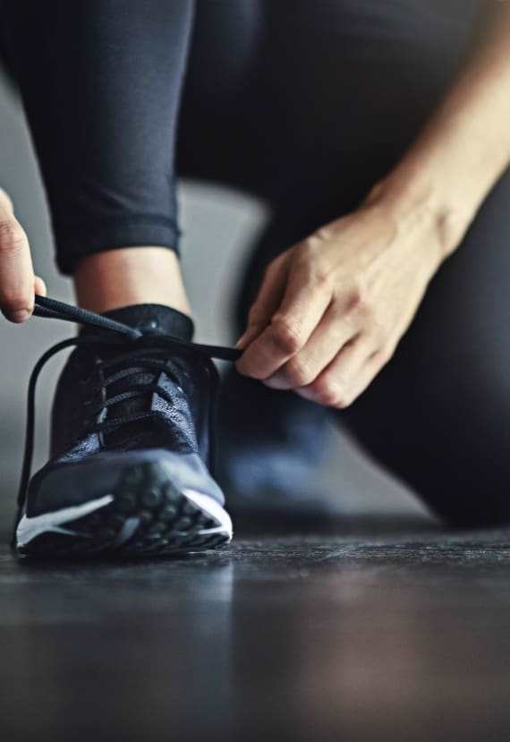 Woman tying her running shoe at 3543 Brook Street, Lafayette, CA 94549