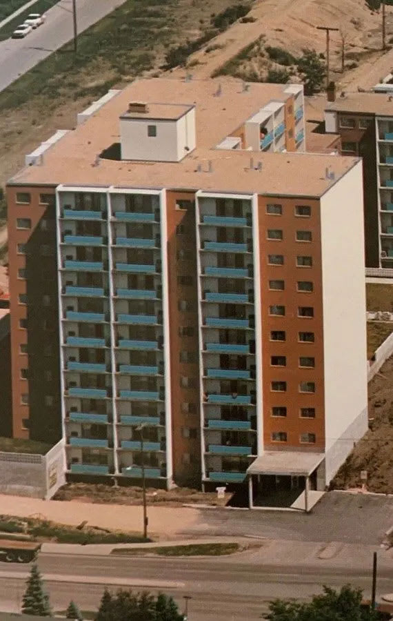 an aerial view of an apartment building in a city