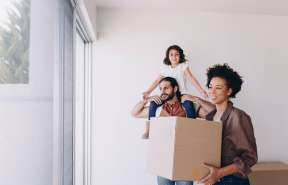 a group of people moving into a house with a box at Connect on Missouri, Phoenix Arizona