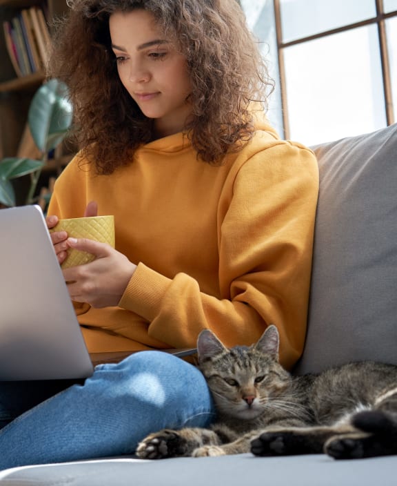 stock photo happy couple with a dog in their new home