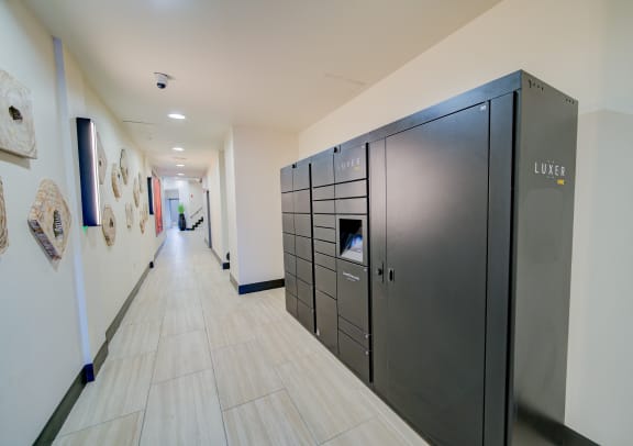 a long hallway with stainless steel refrigerators in a building at The Vine on 8th, Las Vegas, NV