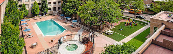 A view of a pool and playground area from a high angle.