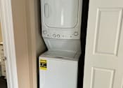 Thumbnail 36 of 48 - A white microwave oven is installed in a kitchen cabinet.