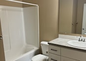 Thumbnail 38 of 48 - A white sink in a bathroom with a white cabinet above it.