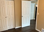 Thumbnail 37 of 48 - A white door is on the bottom and a white door with a window above it.