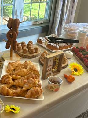 A table filled with pastries and desserts.