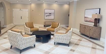 A living room with a checkered floor and a skylight. at Legacy Hills at Poway 55+ Apartments, California