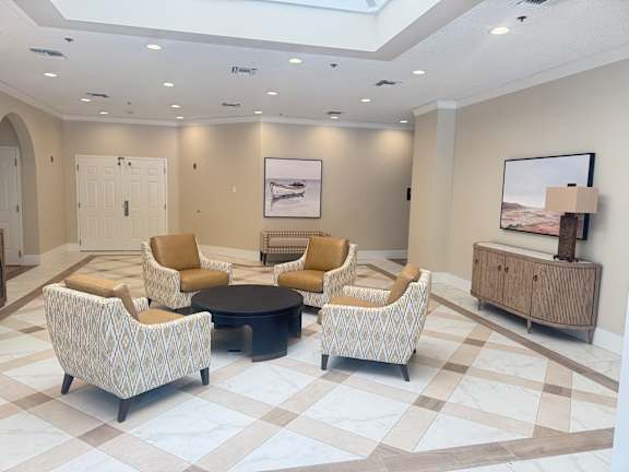 A living room with a checkered floor and a skylight. at Legacy Hills at Poway 55+ Apartments, Poway, California