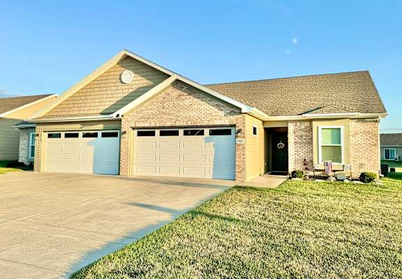 a house with a driveway and a garage door