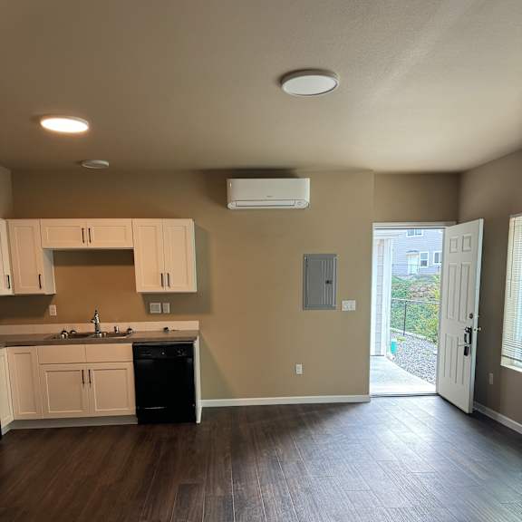 A small room with a TV and a cabinet.