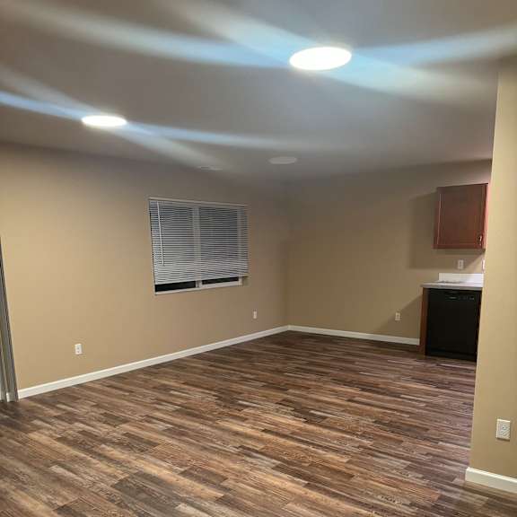 A wall of wood planks runs along the side of a room.
