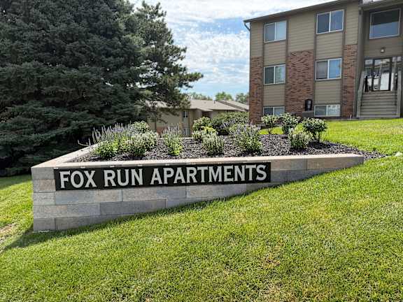 Fox Run Apartments exterior sign welcoming residents to the Omaha community