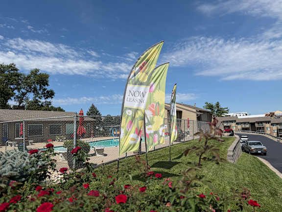 Fox Run Apartments leasing sign in front of the community building and swimming pool in Omaha, Nebraska
