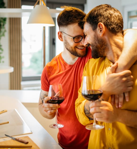 two men drinking wine in a kitchen at Preston Centre, Columbus, 43215