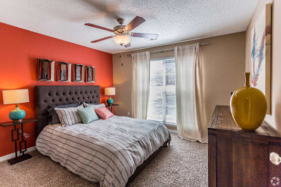 a rendering of a living room with a kitchen in the background  at Quail Ridge Apartment Homes, Bartlett