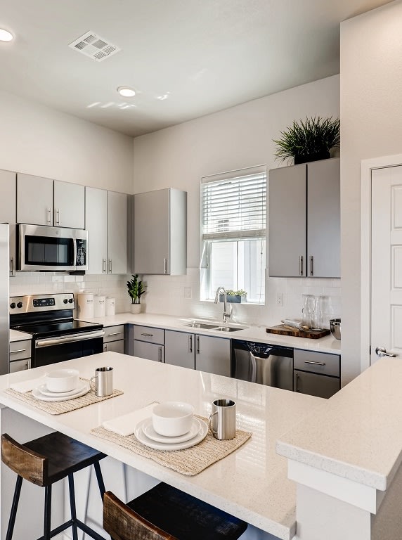 Gourmet Kitchen With Island at Avilla Buffalo Run, Colorado, 80022