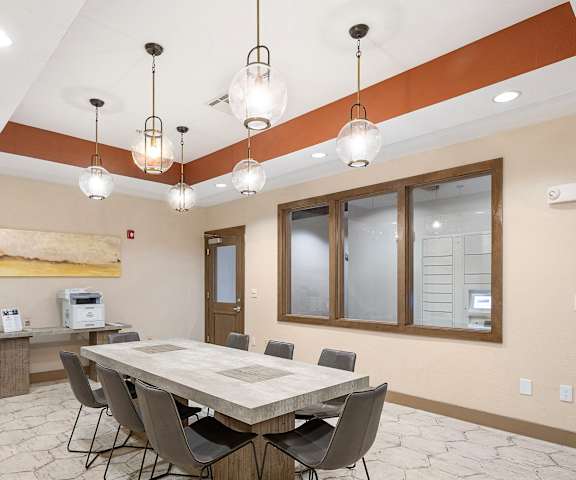 a dining room with a table and chairs at Lakeline East Apartments, Texas