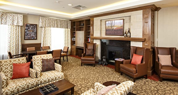 A living room filled with furniture and a fireplace