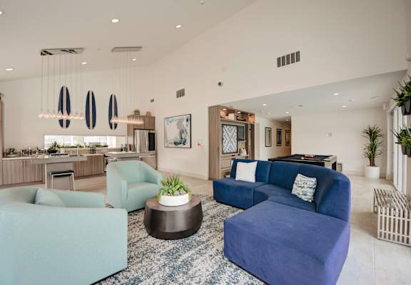 a living room filled with furniture and a large window