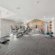 A gym with treadmills and exercise equipment.