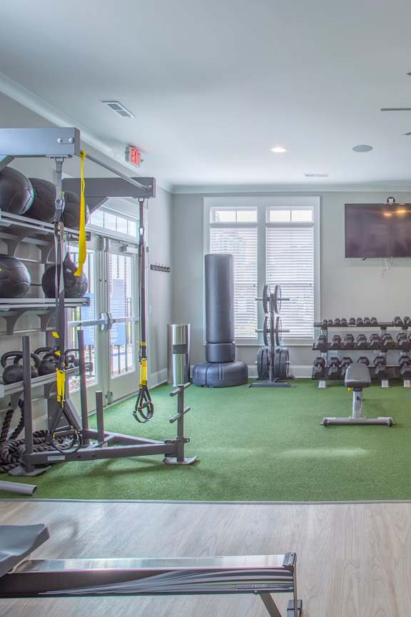 A spacious home gym with a variety of equipment.